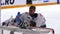 Hockey goalie in protective uniform drinks water at break