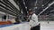 Hockey player throwing all pucks from ice arena border