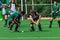 Hockey Players Challenging Possesion Ball