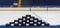 Hockey pucks are stacked on board the arena in the shape of a pyramid