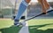 Hockey, sports and ball with a stick in the hands of a woman athlete on a pitch during a competitive game. Fitness