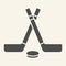 Hockey sticks solid icon. Winter sport signs glyph style pictogram on beige background. Crossed hockey sticks and puck