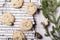 Ð¡hocolate Chip Cookies on cooling rack and on birch bark decorated fir branches and cones