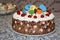 Ð¡hocolate cream pastry cake with baby theme decorations