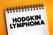 Hodgkin lymphoma - type of cancer that affects the lymphatic system, text concept on notepad