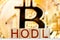 hodl btc concept. wooden blocks with hodl inscription with bitcoin on the background.