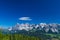 Hohe Dachstein mountain range in Austria with a soft white cloud