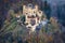 Hohenschwangau bavarian castle old yellow building aerial view with a beautiful fog