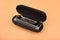 Hohner professional diatonic Rocket harmonica lies in an open black case.
