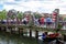 Hoi An, Vietnam - 26 Jul 2019: Tourist bridge on river, historical town landscape. Wooden bridge cross Hoian river