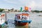 Hoi An, Vietnam - June 2019: colorful tourist boat sailing on Thu Bon river