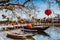 HOI AN, VIETNAM - MARCH 15, 2017: Bridge with decorating lamps and boat over Hoai river in Hoi An ancient town Quang Nam Vietnam