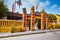 HOI AN, VIETNAM - MARCH 15, 2017: Traditional pink gate of Chinese temple on street of Hoi An ancient town, Vietnam