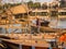 HOIAN, VIETNAM, SEPTEMBER, 04 2017: Unidentified people in the traditional boats in front of ancient architecture in Hoi