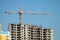 Hoisting tower crane and top of construction building