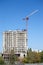 Hoisting tower crane and top of construction building