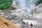 Hokkaido, Japan - July 13 ,2018: Many tourists toke a look Famous Noboribetsu Jigokudani Hell Valley, the explosion crater