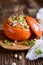 Hokkaido pumpkin stuffed with chickpeas, quinoa, mushrooms and pepper