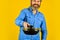 Hold frying pan. best quality. bearded cook portrait with kitchen tools. bearded man hold cooking pan. cook preparing