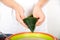 Hold the zong leaves with both hands into a funnel shape and prepare to make zongzi