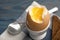 Holder with soft boiled egg on table, closeup