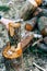 Holding Alder Log with Hand  Preparing for Splitting Firewood