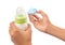 Holding Blue Pacifier and Infant Formula I