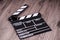 Holding clapper board or slate film concept On wooden table.