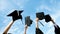 Holding graduation hats