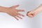 Holding guessing fist gesture in front of the white background