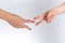 Holding guessing fist gesture in front of the white background