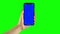 Holding hand a mobile smartphone blue screen. Green screen