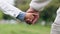 Holding hands, closeup and park with father, child and walking with bonding, love and security in nature. Dad, kid and