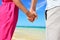 Holding hands romantic newlyweds couple on beach