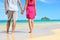 Holding hands romantic newlyweds couple on beach