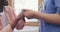 Holding hands, support and nurse with woman patient, help and trust for elderly care and wellness. Health, calm and