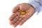 Holding medicine pills like fish oil tablets and vitamin tablet