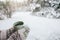 Holding mug with tea over snowy view