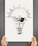 Holding poster show hand drawn light bulb