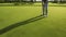 Hole-in-One Hope - Golf player at the putting green. Hitting ball into a hole. Generative AI