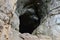 Hole in rock, entrance to cave, Russia, Ural mountain.