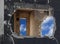 Hole and sky between the walls of a destroyed house