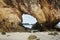 A hole on a small quartzite mountain on the sandy beach