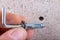 Hole in the wall, screw and dowel for fixing in concrete. Wall mounting methods