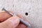 Hole in the wall, screw and dowel for fixing in concrete. Wall mounting methods