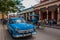 Holguin, Cuba: retro blue old car and horse cart on the street