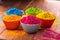 Holi color powder. Organic Gulal colours in bowl for Holi festival, Hindu tradition festive. Bright vibrant pigment