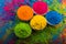 Holi color powder. Organic Gulal colours in bowl for Holi festival, Hindu tradition festive. Bright vibrant pigment closeup