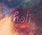 HOLI text and colorful galaxy background.