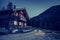 Holiday in the alps: Rustic wooden farm hut in the night